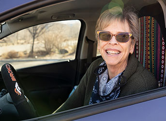 Photo of a woman smiling. Link to Life Stage Gift Planner Ages 60-70 Situations.